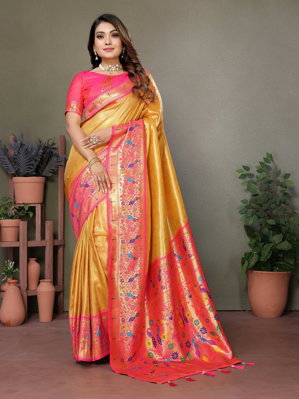 A vibrant yellow Tissue Silk Paithani woven saree with traditional intricate patterns.