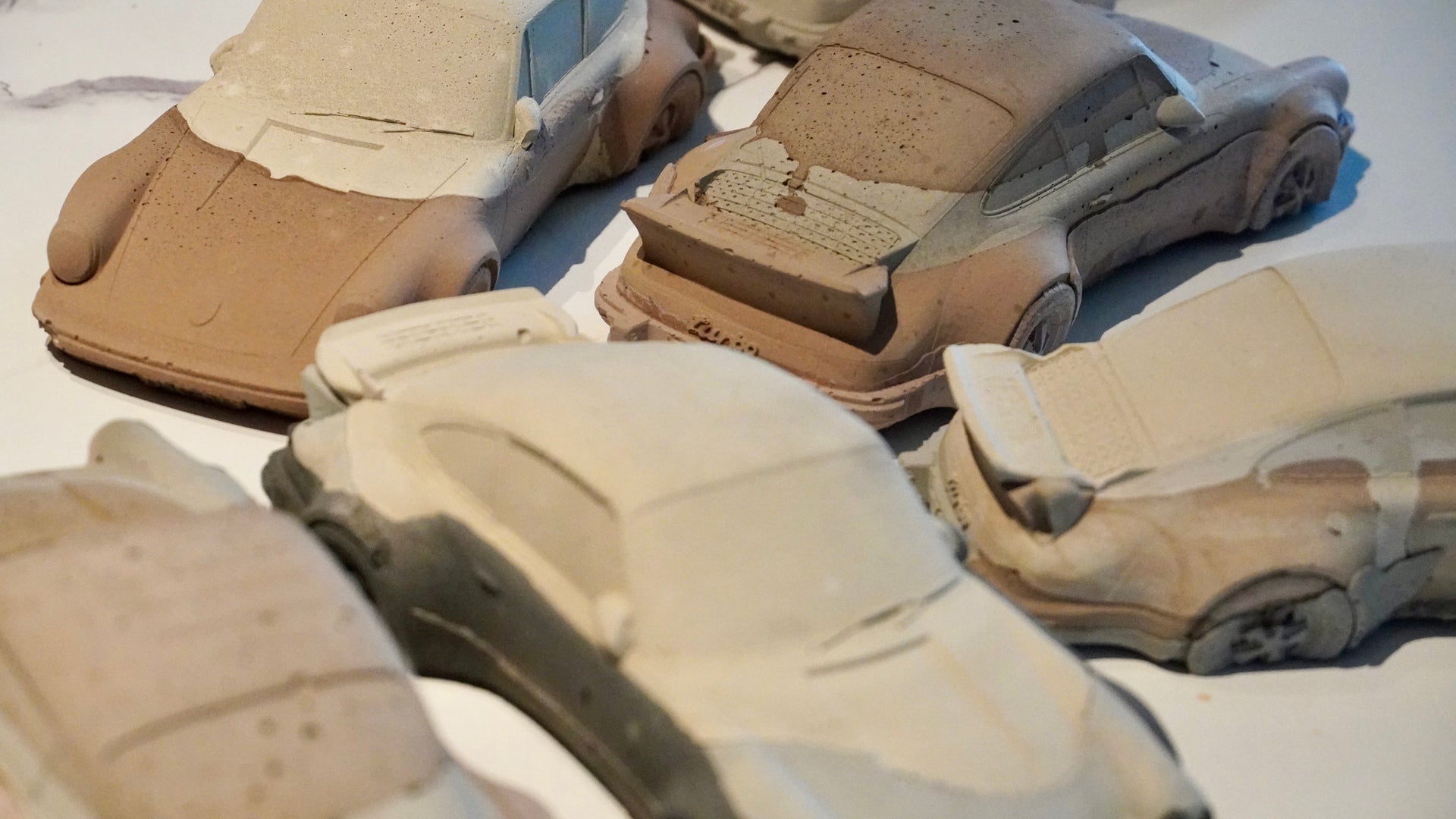 Multilayer concrete 930 Turbo sculpture in shades of beige, brown, and grey