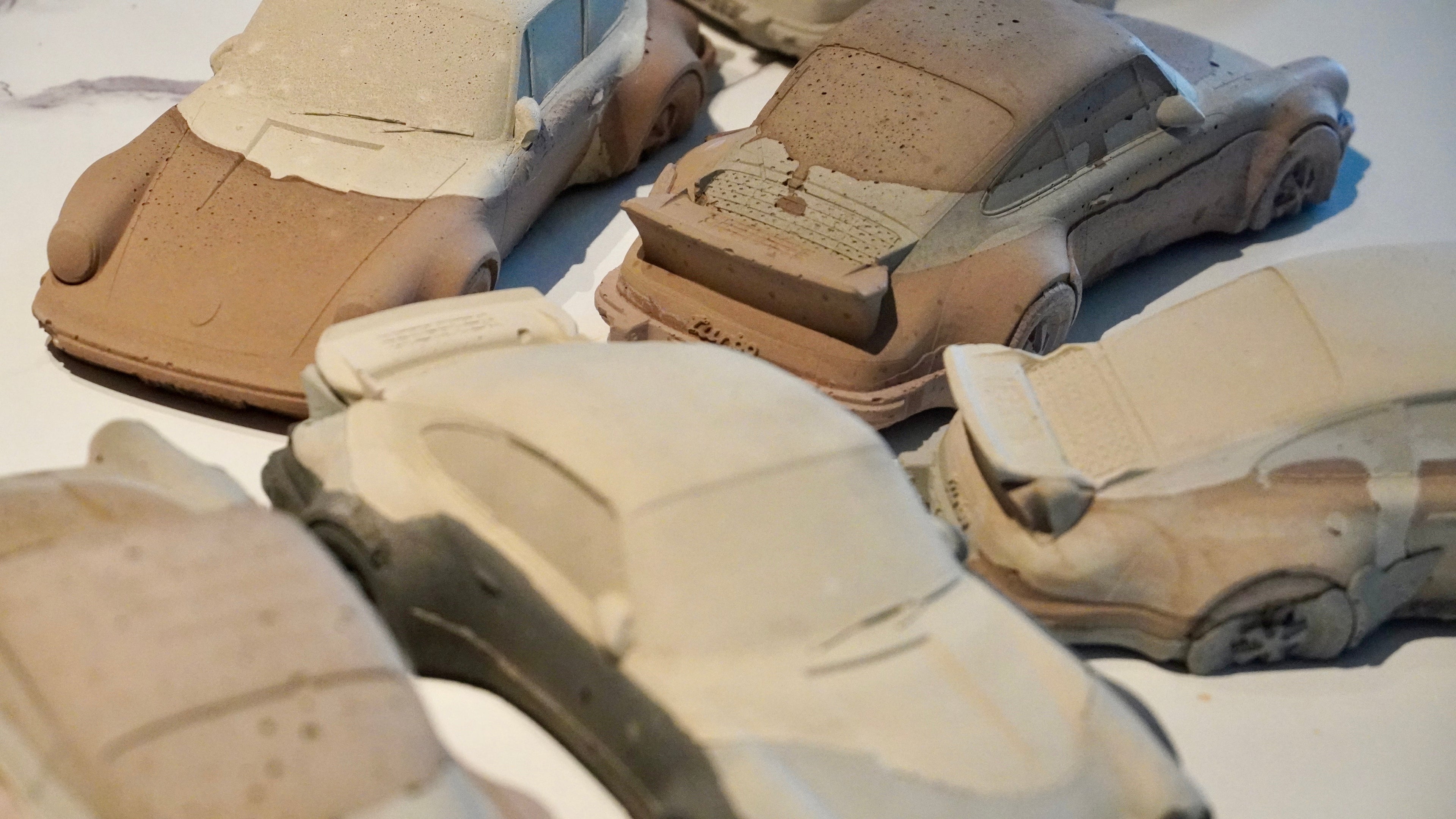 Multilayer concrete 930 Turbo sculpture in shades of beige, brown, and grey