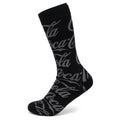 A pair of black crew socks featuring a repeated gray Coca-Cola script logo pattern.
