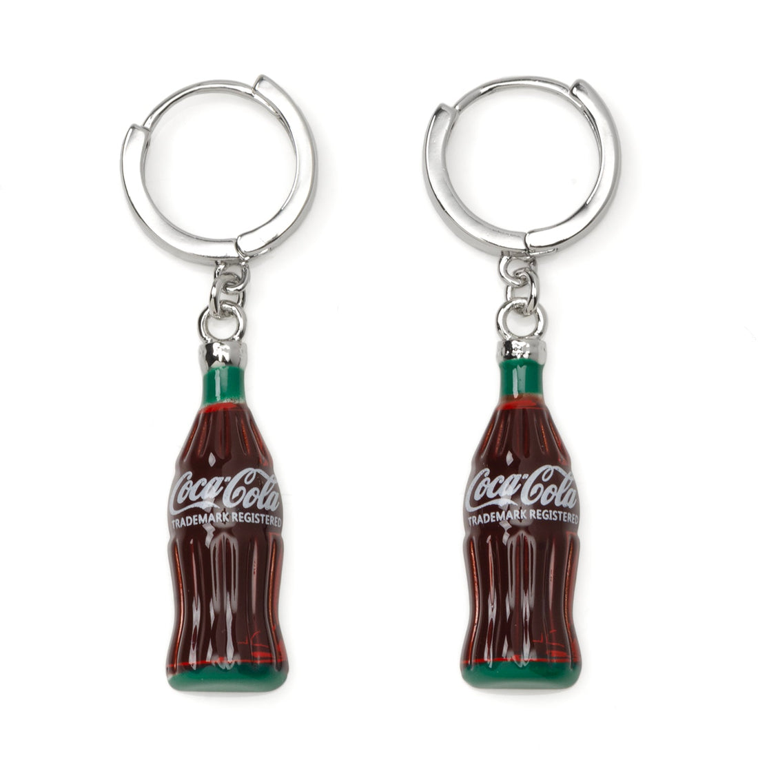 A pair of Coca-Cola glass bottle dangle earrings featuring silver-tone hoop closures on a white background.