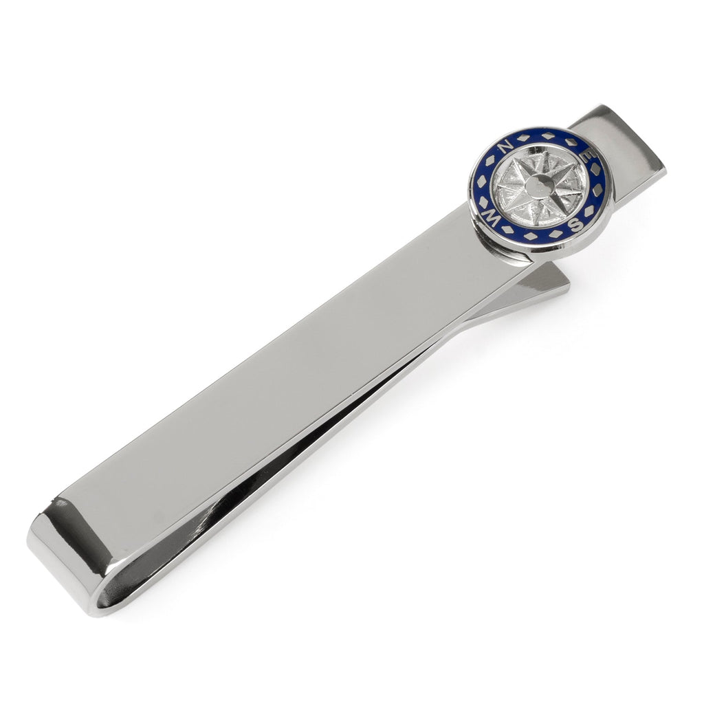 Silver tie bar with a navy blue and silver compass detail on a formal blue tie and grey suit jacket