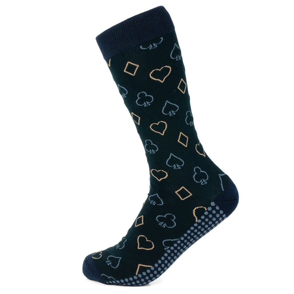 A pair of navy blue men's crew socks with a repeating pattern of tan and light blue card suit symbols, featuring a grip sole design.