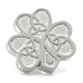 Silver tone clover lapel pin featuring a raised Celtic knot design with a clutch-back closure