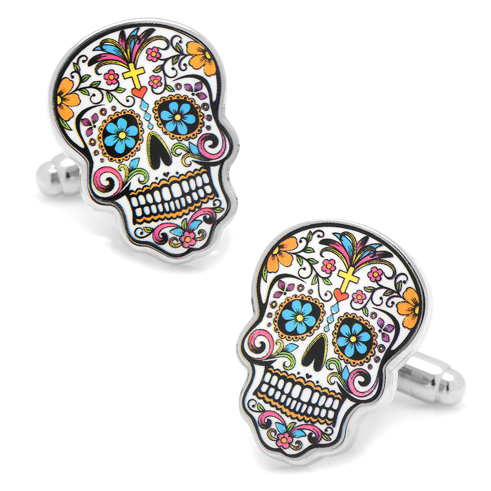 A pair of silver-tone cufflinks featuring a colorful Day of the Dead sugar skull design on a white background.