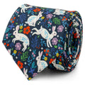 A navy blue men's necktie decorated with a white rabbit and colorful floral pattern, shown in a rolled detail shot and on a mannequin.