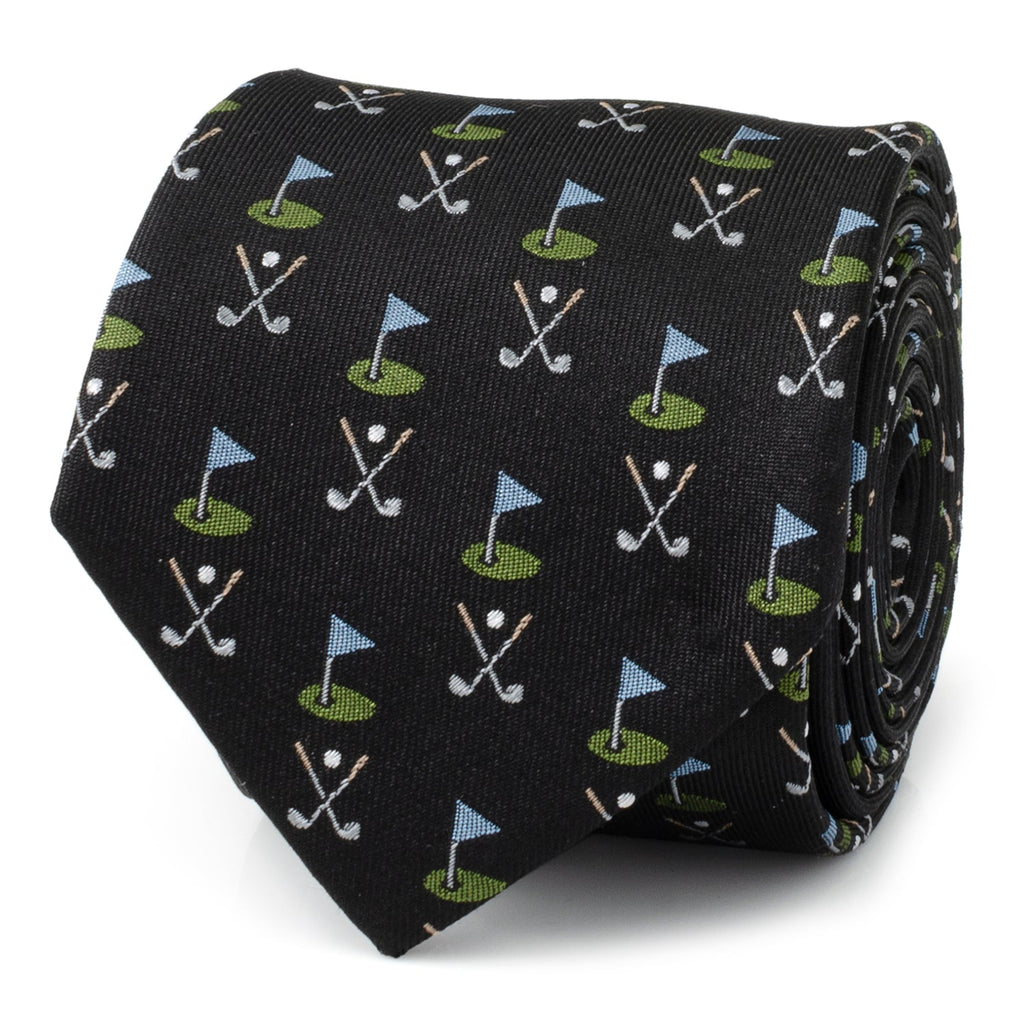 Close up of a black silk necktie with a pattern of golf clubs and golf course flags.