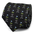 Close up of a black silk necktie with a pattern of golf clubs and golf course flags.