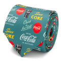 A green men's necktie featuring various Coca-Cola vintage logos, slogans, and soda glass illustrations.