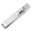 A silver tone tie bar featuring a hunting dog silhouette design, shown pinned to a blue patterned tie.