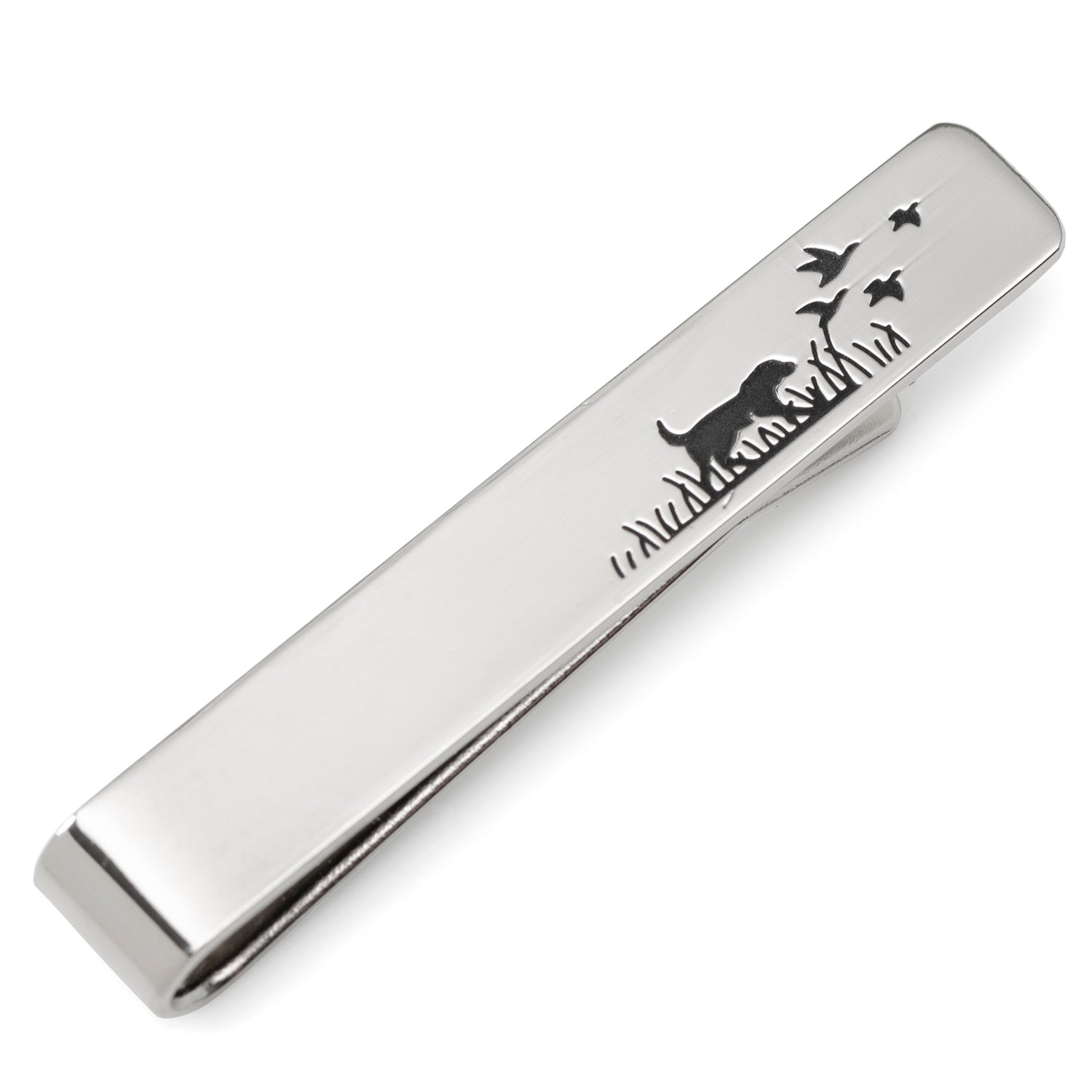 A silver tone tie bar featuring a hunting dog silhouette design, shown pinned to a blue patterned tie.