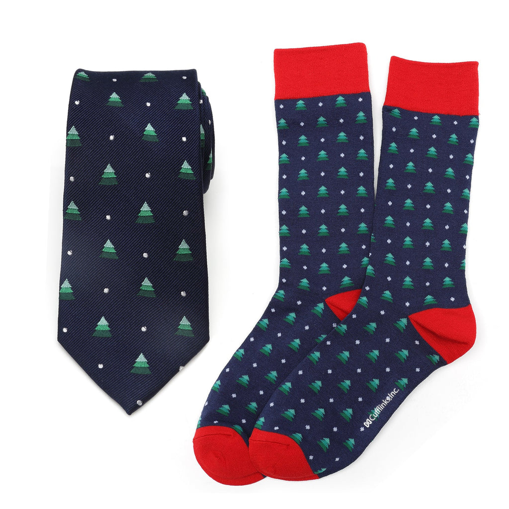 Holiday tree print necktie and matching navy blue socks with red accents in a gift box