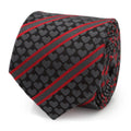 A black necktie with gray heart patterns and ruby red ribbon stripes shown on a dress shirt.