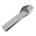 Silver-tone tie bar with a black enamel Caduceus symbol attached to a black necktie.