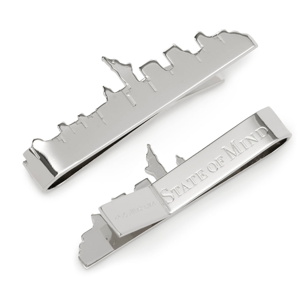 Polished silver tie bar shaped like the New York City skyline with State of Mind engraving on the back