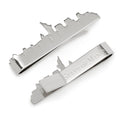 Polished silver tie bar shaped like the New York City skyline with State of Mind engraving on the back