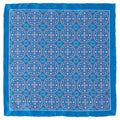 Blue silk pocket square featuring a repetitive Aboriginal-inspired pink ornament pattern folded in a suit pocket
