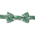 Green and white palm leaf print pre-tied cotton bow tie on a white background