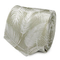 Close up of a rolled light sage green necktie featuring a subtle white palm leaf pattern