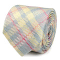 Close up of a rolled silk necktie with a pastel plaid pattern in pink, yellow, and blue.