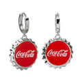 A pair of silver-tone Coca-Cola bottle cap dangle earrings with red enamel and white Coca-Cola logo.