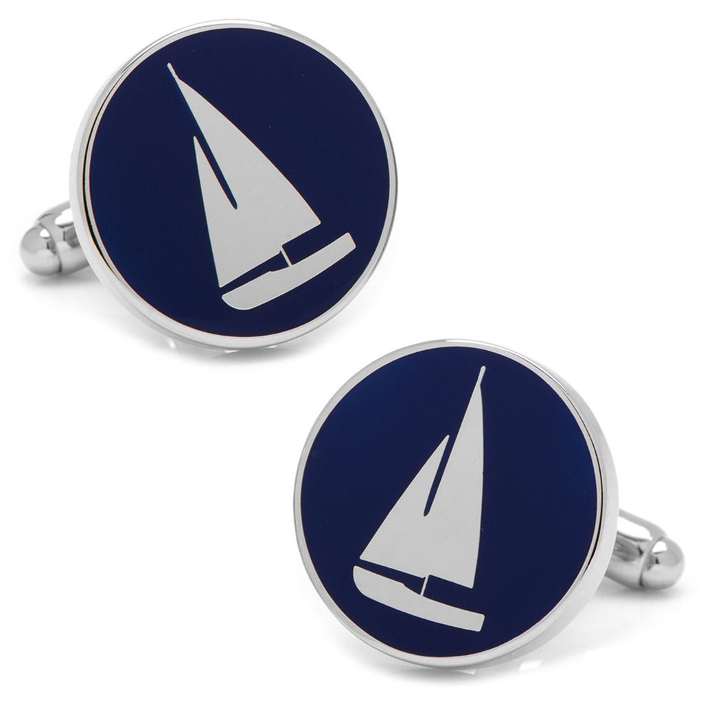 Round silver cufflinks featuring a white sailboat graphic on a navy blue background.
