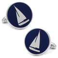 Round silver cufflinks featuring a white sailboat graphic on a navy blue background.