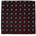 A square black silk pocket square patterned with colorful sugar skulls and red roses.