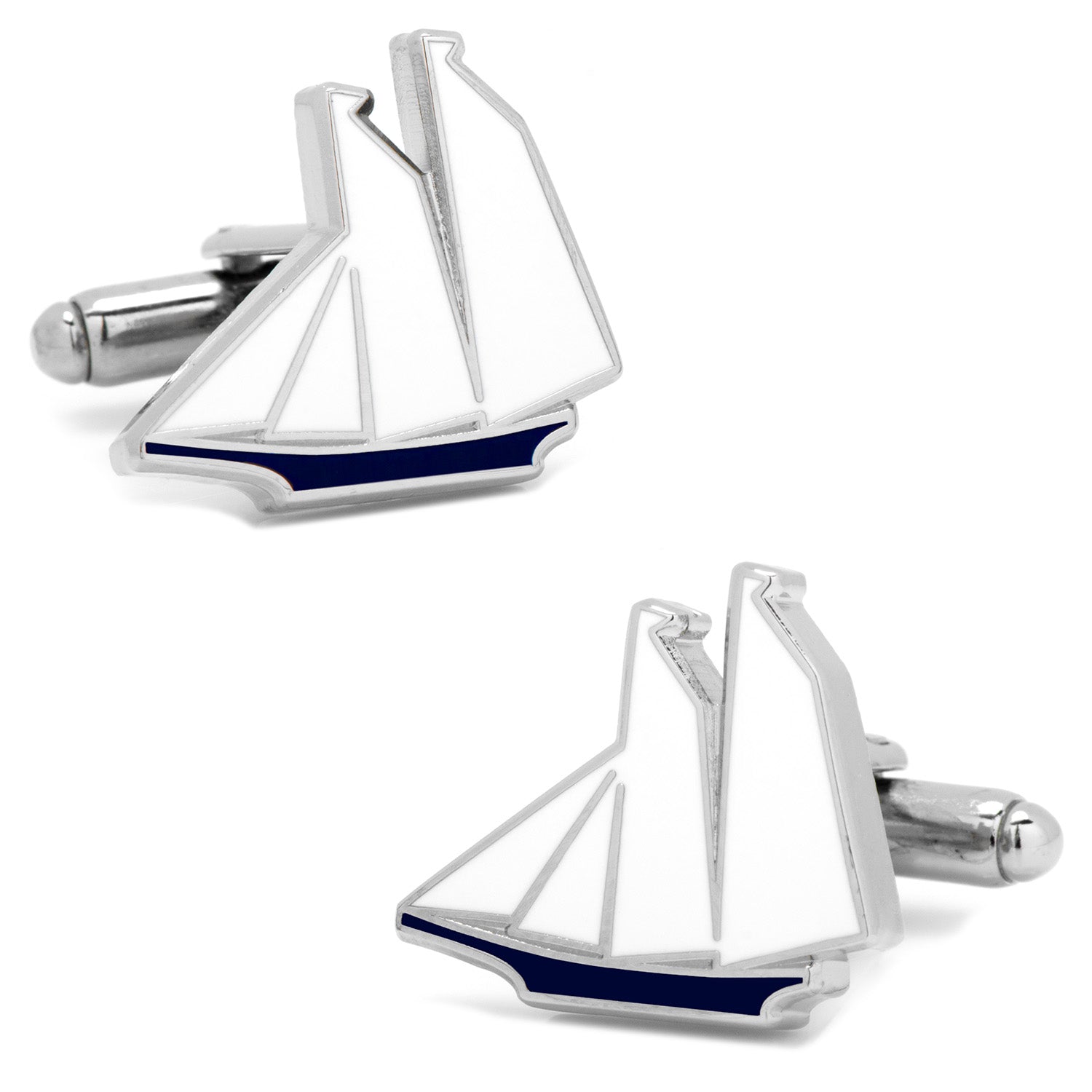 A pair of silver tone cufflinks featuring a sailboat design with white sails and a navy blue hull on a white background.