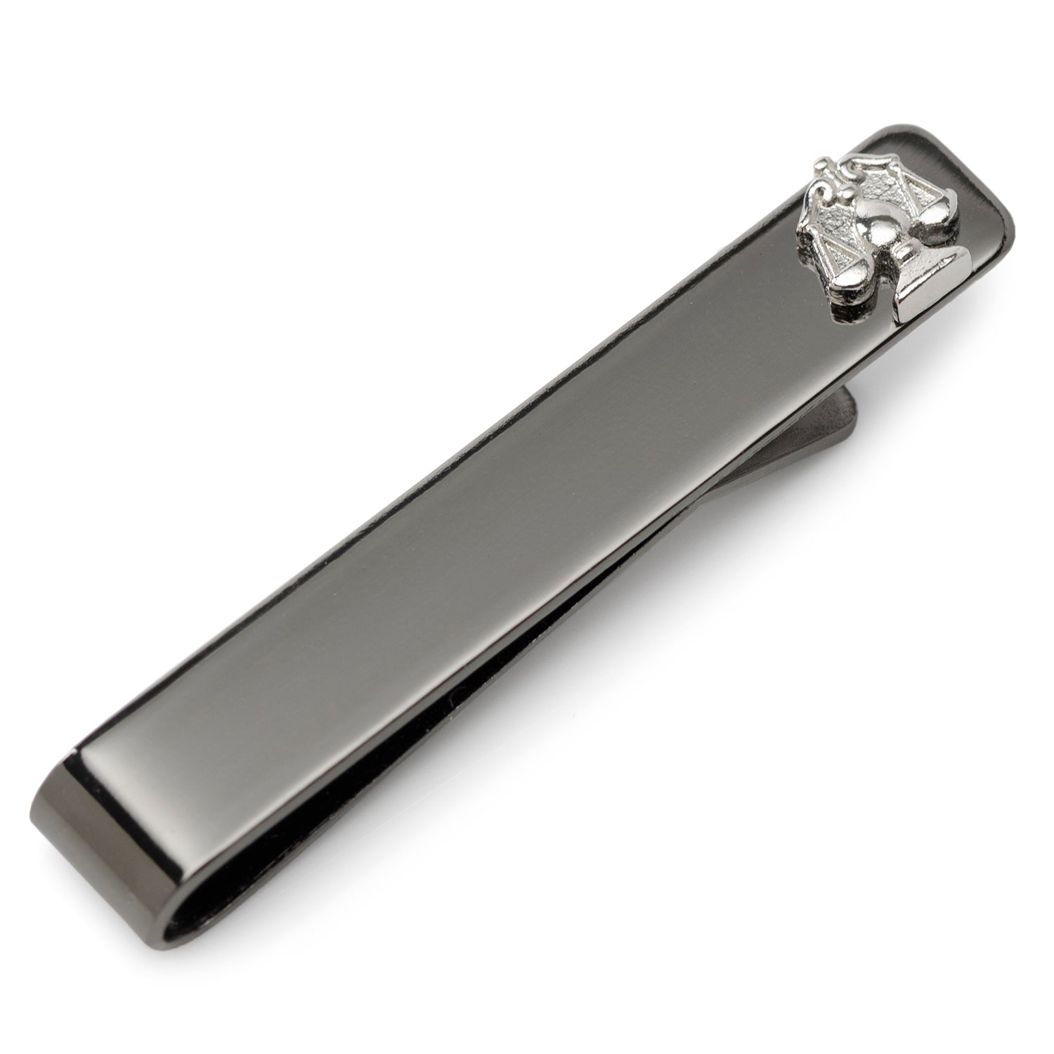 Close-up of a gunmetal Scale of Justice tie bar clipped onto a blue patterned necktie