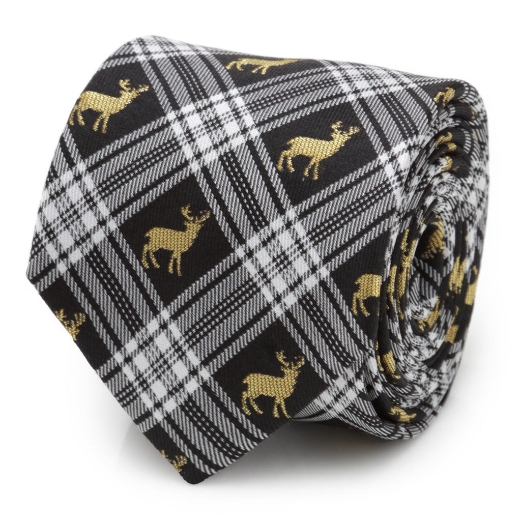 A close up view of a black and white plaid necktie with gold stag patterns, shown in a roll and on a mannequin.