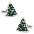 A pair of silver-toned metal cufflinks shaped like Christmas trees, decorated with green, red, and yellow enamel on a white background.