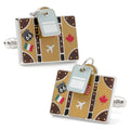 Traveler suitcase themed cufflinks featuring a luggage tag and travel stickers, front and back view.