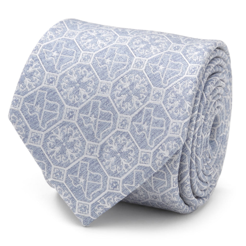 Pale blue silk necktie featuring geometric patterns and Lone Star State Texas icons.