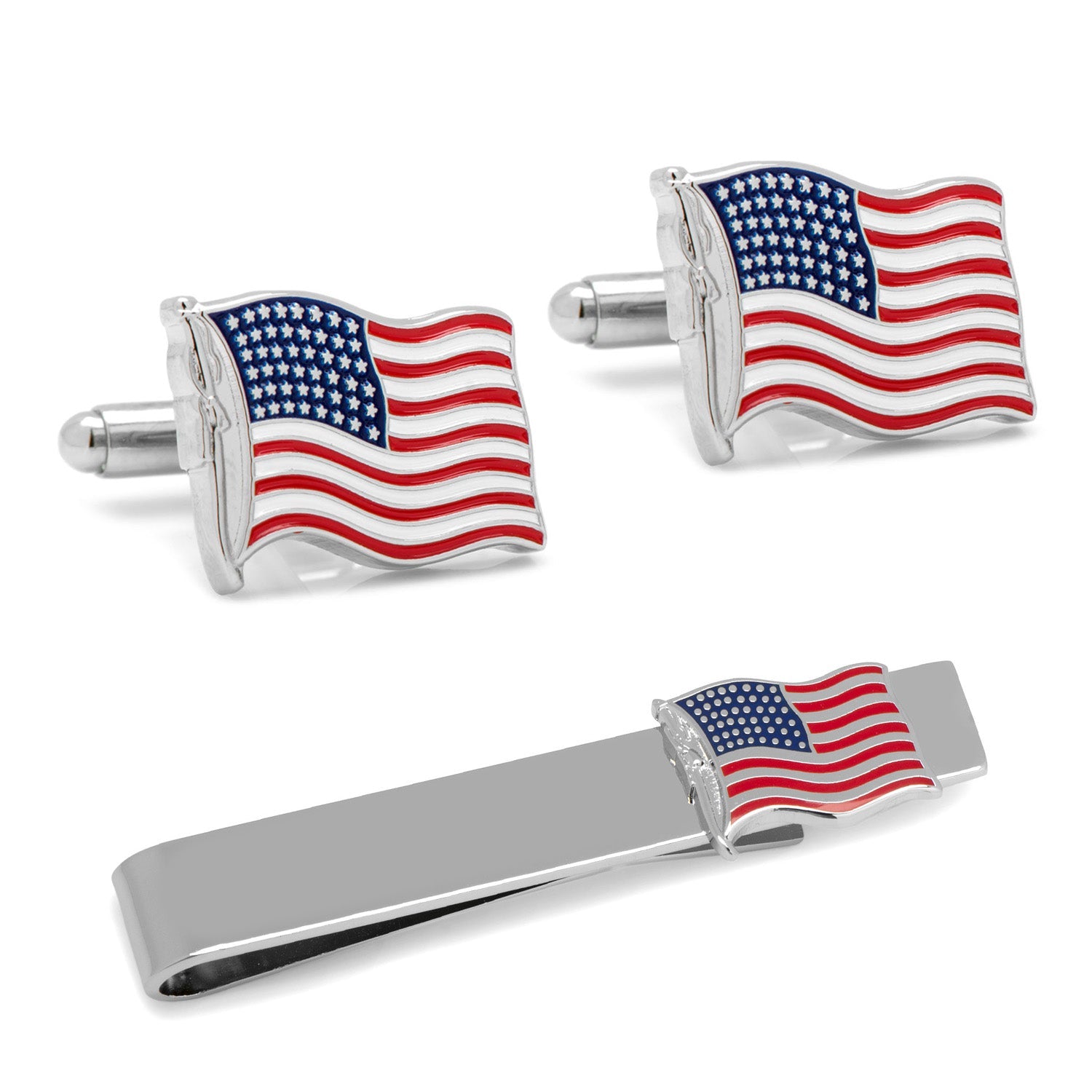 A set of American flag cufflinks and a matching silver tie bar resting in a black gift box.