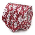 Close-up view of a red men's necktie featuring a white Christmas ornament pattern, shown rolled up.