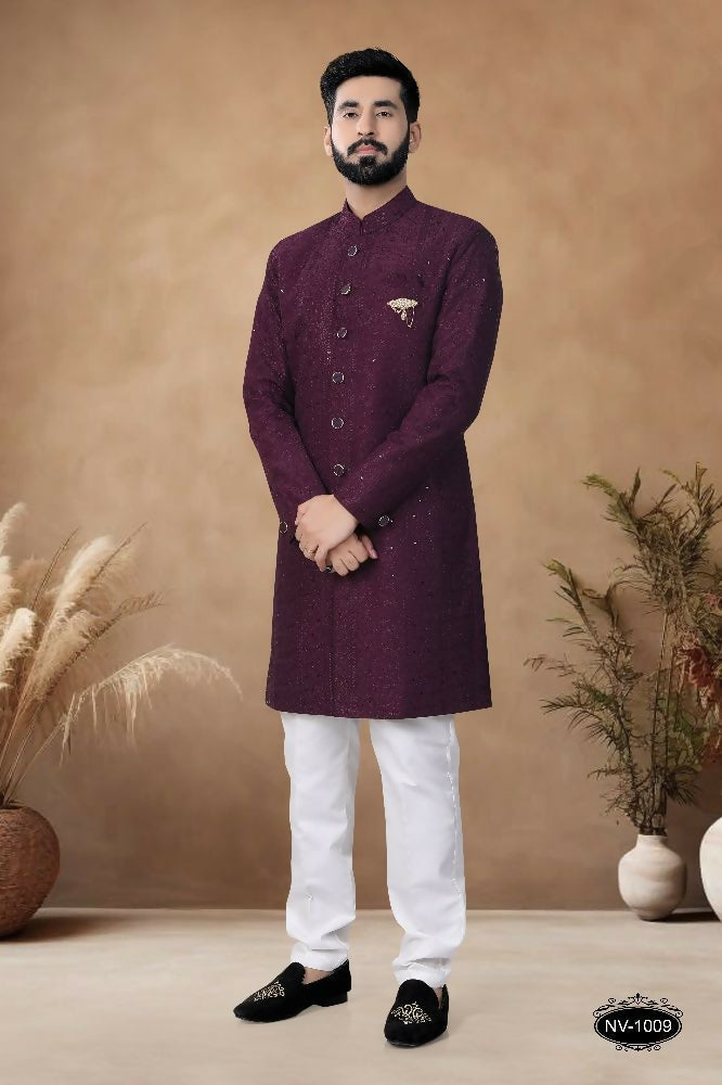 Elegant wine-colored men's silk kurta with all-over thread and sequence embroidery detail.