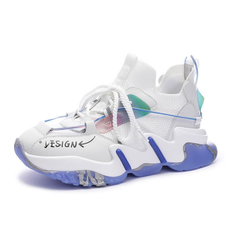 White women's platform sneakers with iridescent accents, lace-up closure, and chunky sole, featuring a breathable knit and microfiber upper.