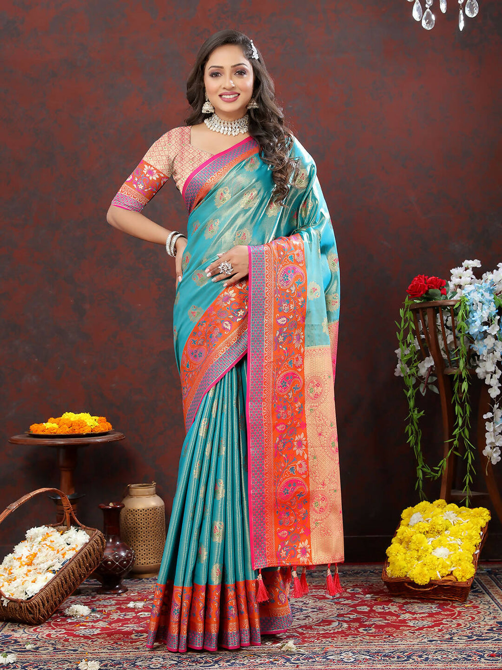 Festive skyblue Kanjivaram silk saree with intricate gold, orange, and pink zari weaving