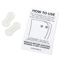Clear silicone cufflink adapter tabs shown next to instruction card