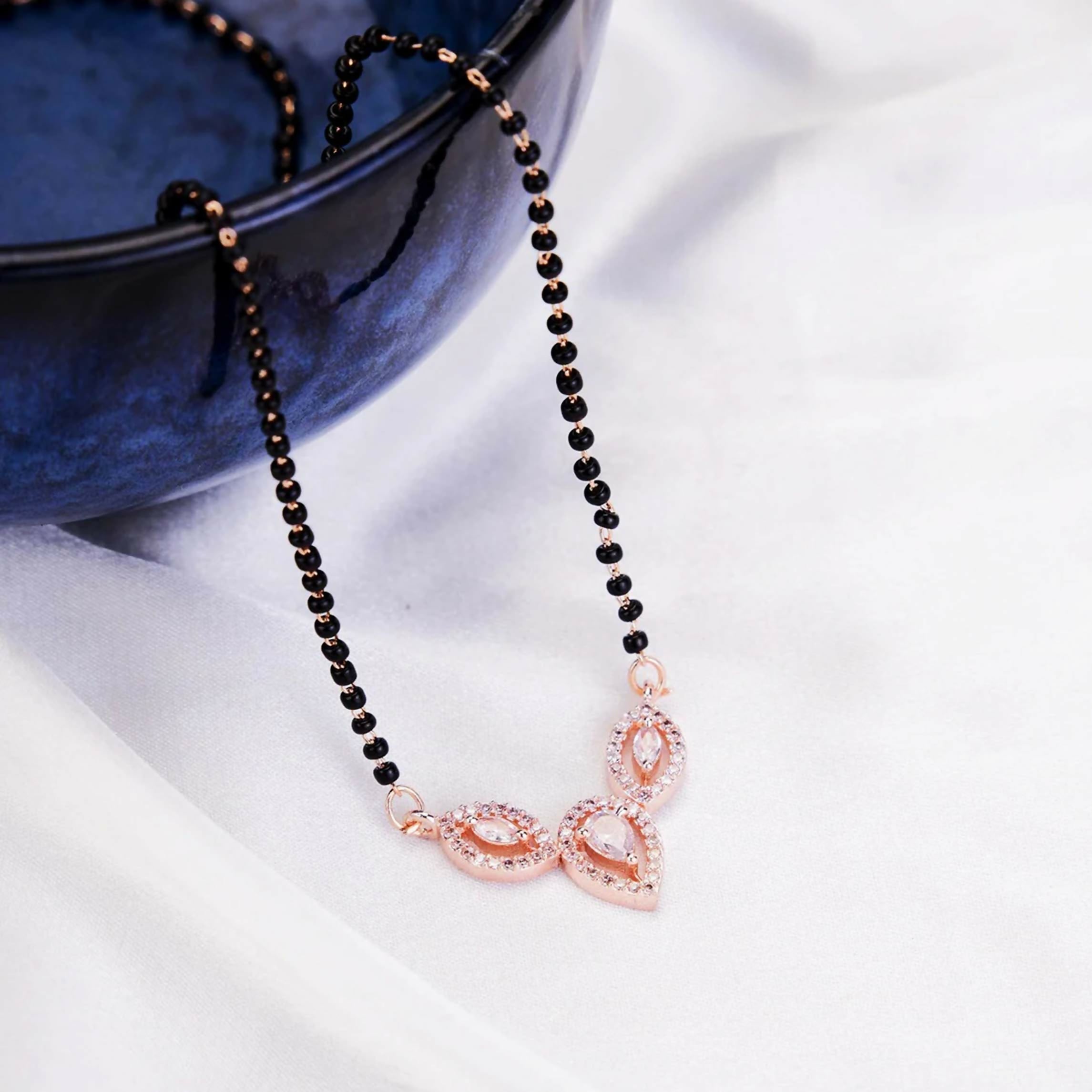 Close-up of a white AD stone mangalsutra in brass, showcasing elegant craftsmanship for women