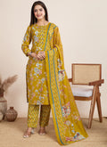 Woman wearing a vibrant yellow printed cotton blend salwar suit with matching pants