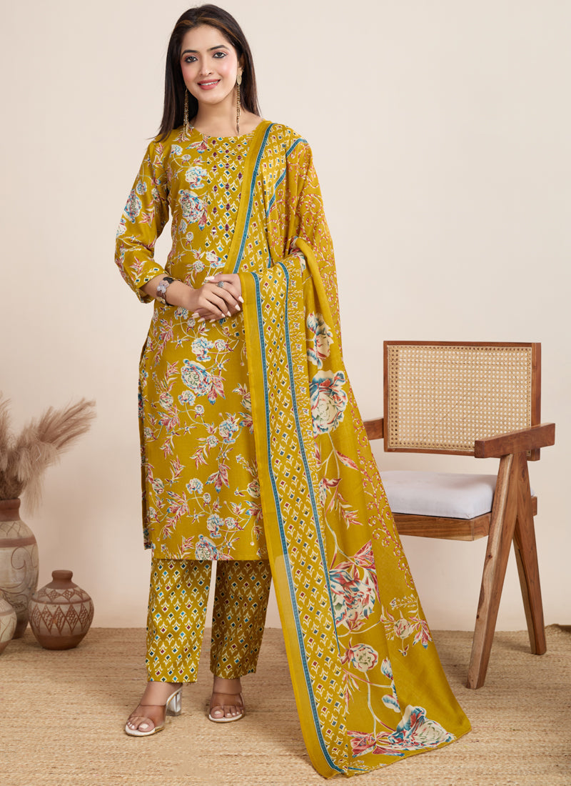 Woman wearing a vibrant yellow printed cotton blend salwar suit with matching pants