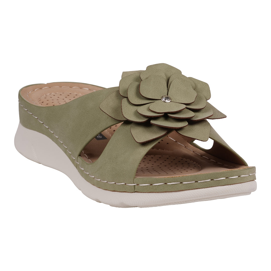 Side view of a pair of women's green sandals featuring a large flower rosette on the strap and a comfortable white cushioned sole
