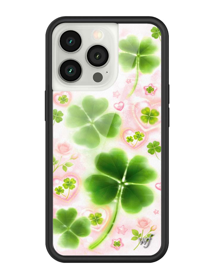Phone case with green four-leaf clover design on a pink floral background
