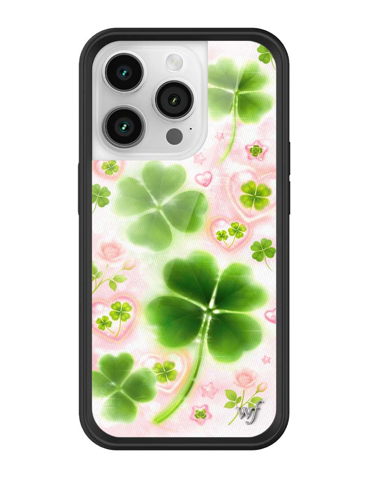 Phone case with green four-leaf clovers on a pink floral background