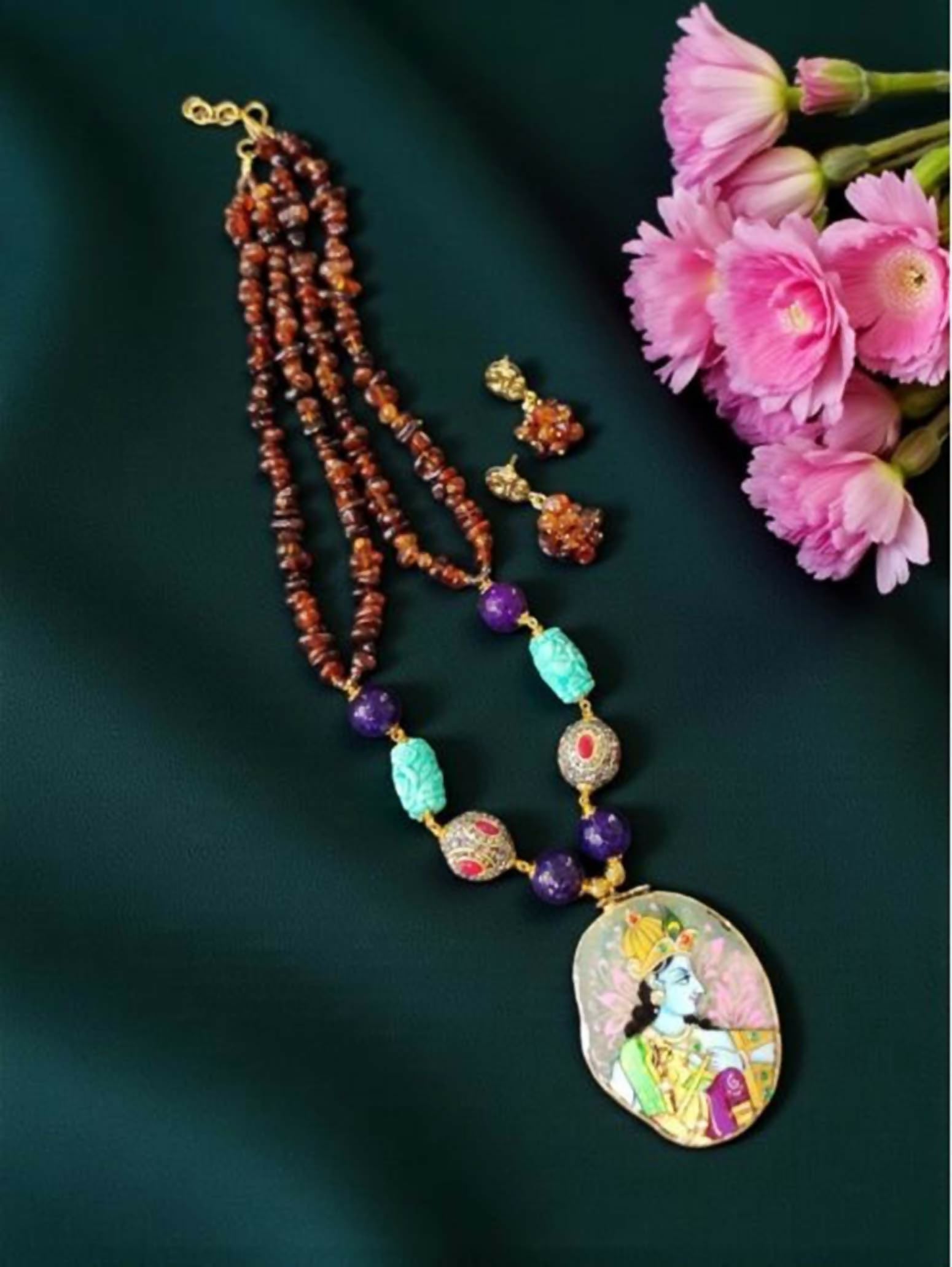 Multi-strand statement necklace featuring Onyx beads, dyed Mother of Pearl chips, and hydro beads.