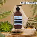 White Woods Pomegranate Peony Aromatic Hand Soap in a modern brown pump bottle, displayed on a stone surface.