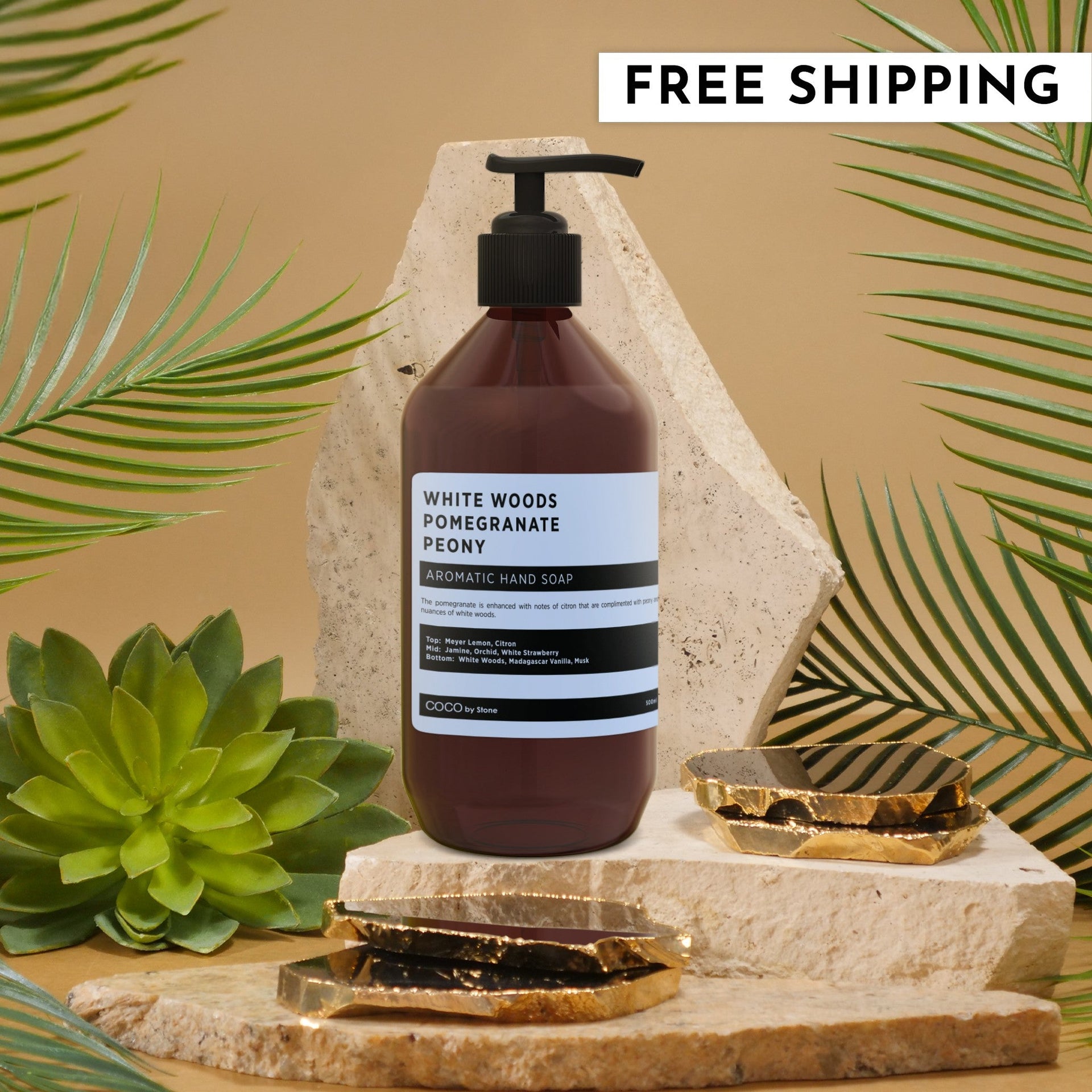 White Woods Pomegranate Peony Aromatic Hand Soap in a modern brown pump bottle, displayed on a stone surface.