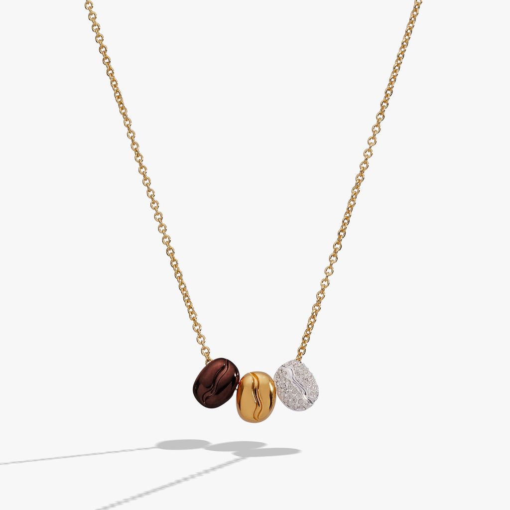 Tritone coffee bean slider pendant necklace with gold, silver, and brown charms on a gold-plated chain